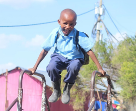 Happy boy who received food from Feeding Children Everywhere doing business as U.S. Hunger