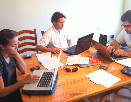 Man who founded U.S. Hunger (Formerly Feeding Children Everywhere) working at dining room table